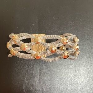 Silver & gold tone magnetic bracelet.